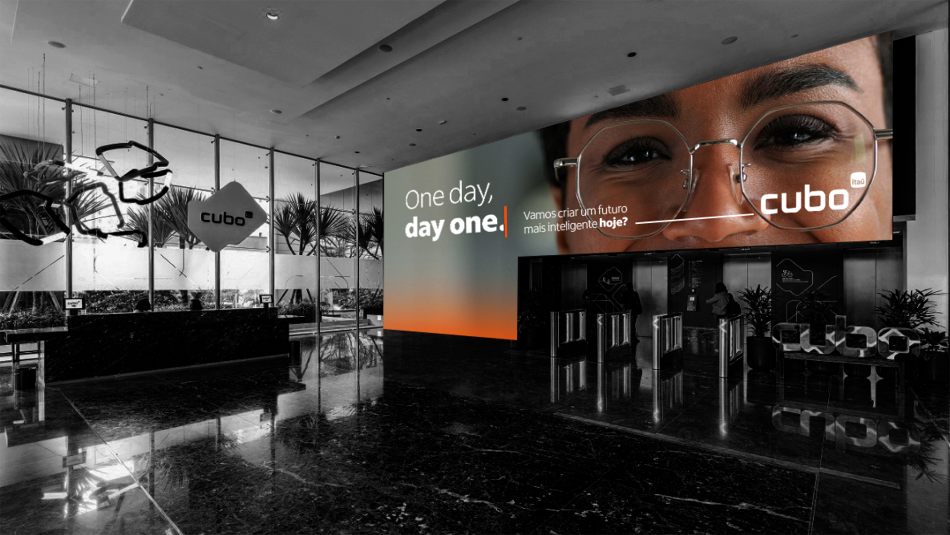 Lobby do Cubo Itaú com telão exibindo a campanha One day, day one